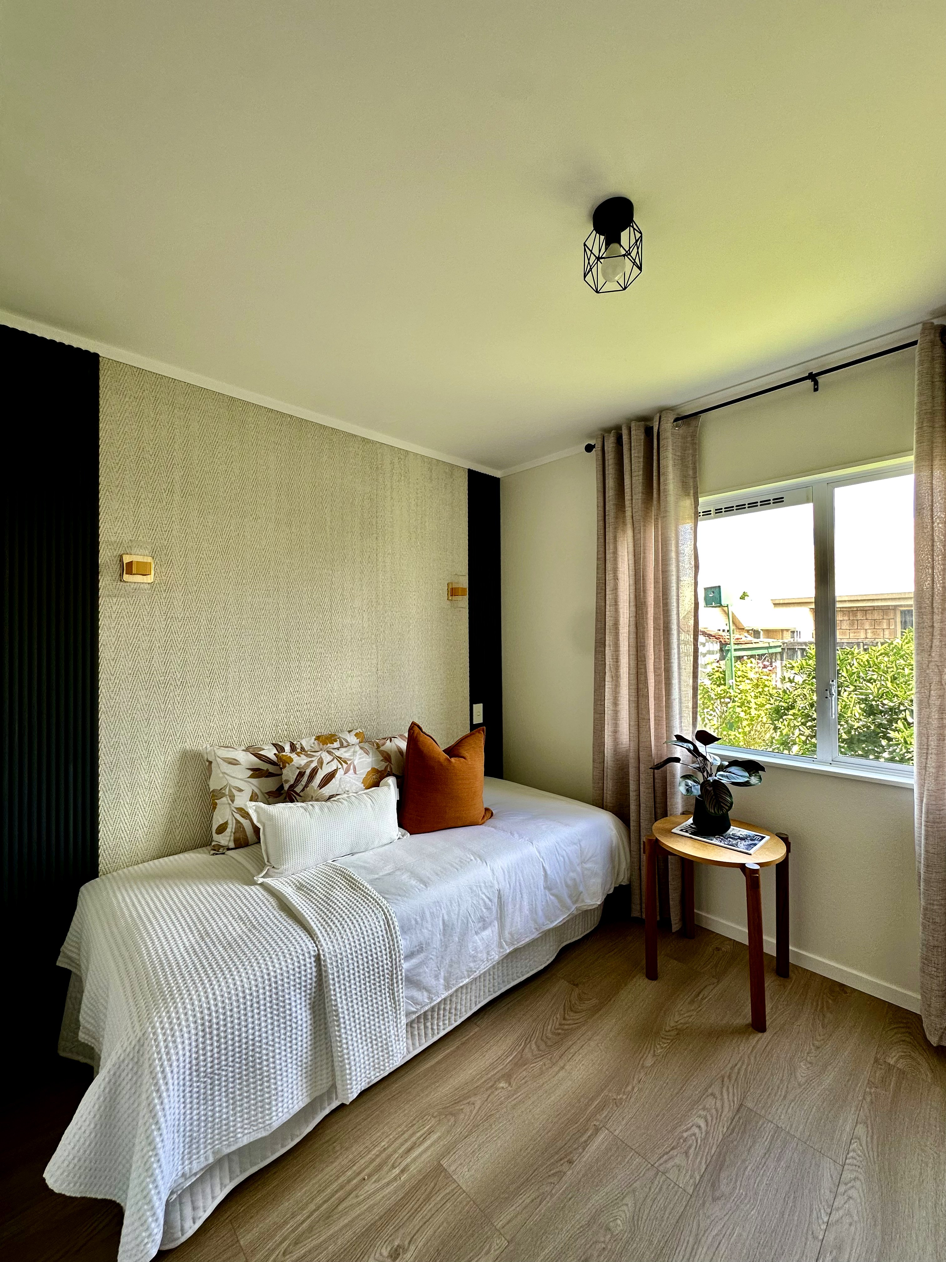 Third bedroom with feature wall